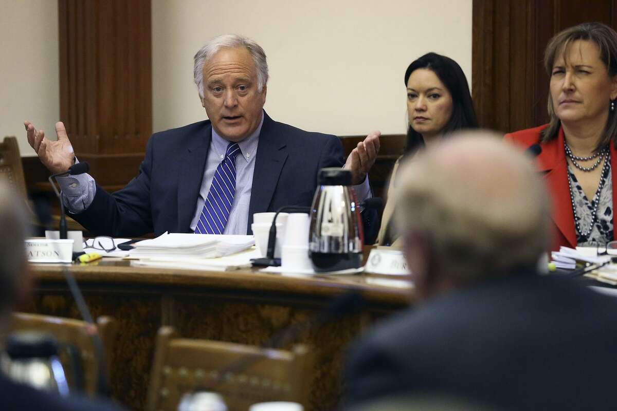 Senator Kirk Watson stresses a point with Robert S. Hicks as the Senate Committee on Nominations questions candidates for the University of Texas System Board of Regents at the State Capitol on February 26, 2015.