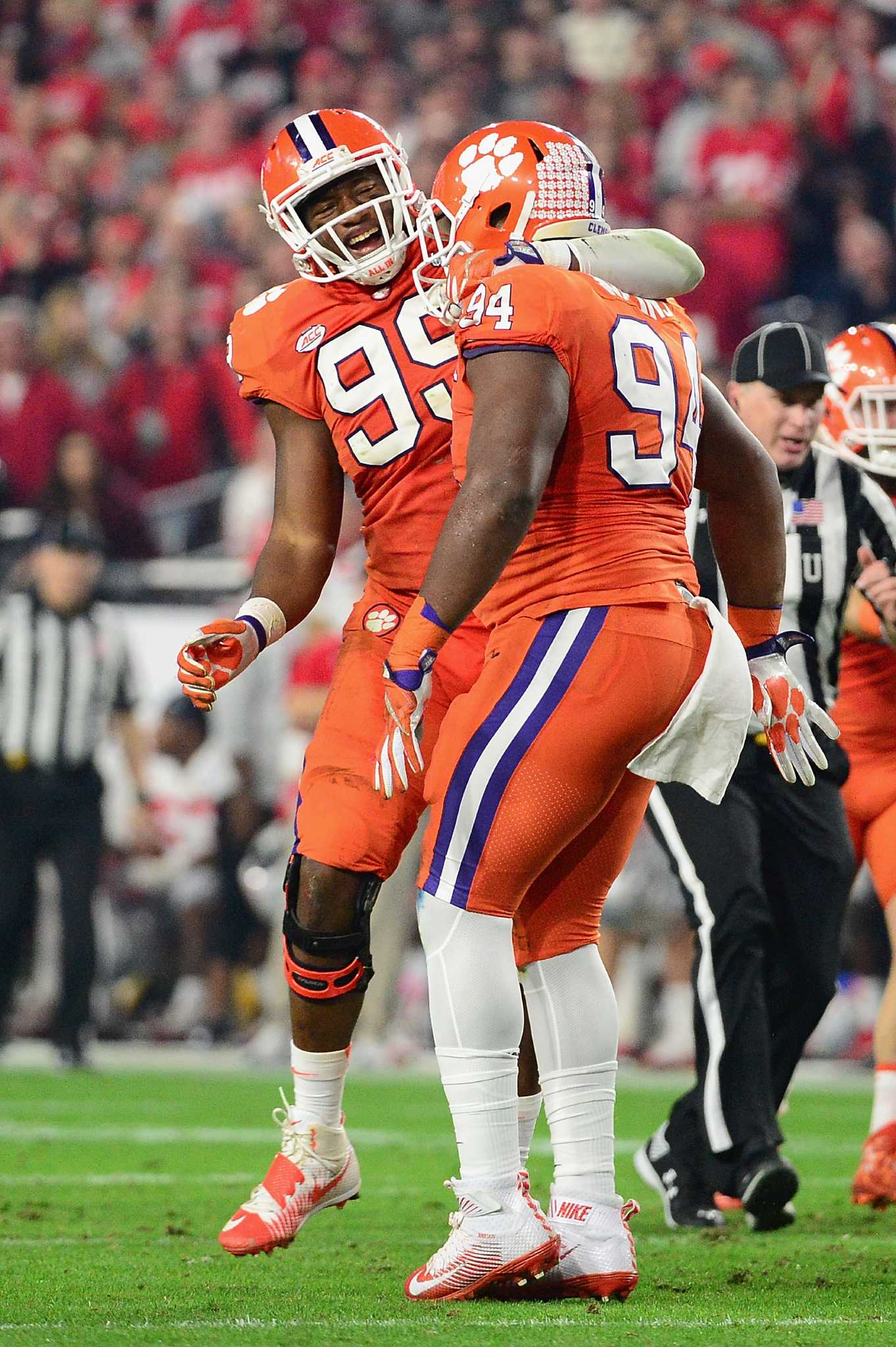 Raiders defensive end Clelin Ferrell (99) warms up on the field before an  NFL playoff game agai …