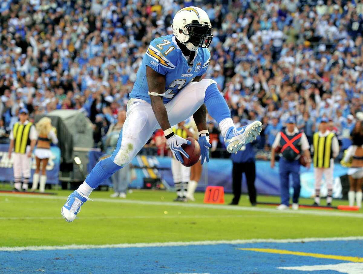 FILE - In this Nov. 29, 2009, file photo, San Diego Chargers running back LaDainian Tomlinson celebrates his second touchdown during the third quarter of an NFL football game against the Kansas City Chiefs, in San Diego, Calif. Tomlinson is a finalists for the Pro Football Hall of FameÂs Class of 2017, the Hall announced Tuesday, Jan. 3, 2017. (AP Photo/Chris Carlson, File)
