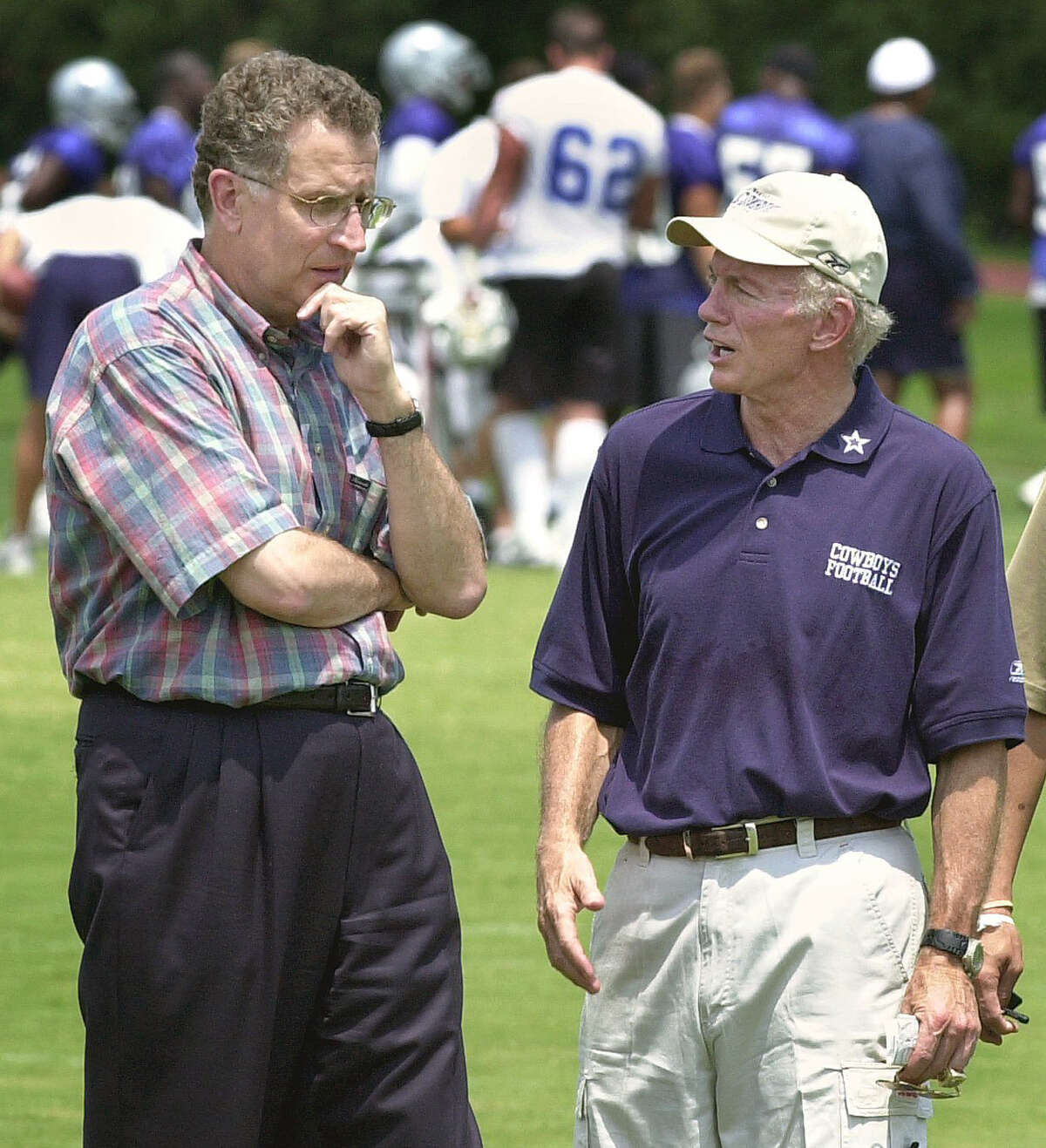 FILE - In this July 14, 2002, file photo, NFL Commissioner Paul Tagliabue, left, chats with Dallas Cowboys owner Jerry Jones during a visit by the commissioner to team's NFL football minicamp in Irving, Texas. Tagliabue and Jones are both finalists for the Pro Football Hall of FameÂs Class of 2017, the Hall announced Tuesday, Jan. 3, 2017. (AP Photo/Tony Gutierrez, File)