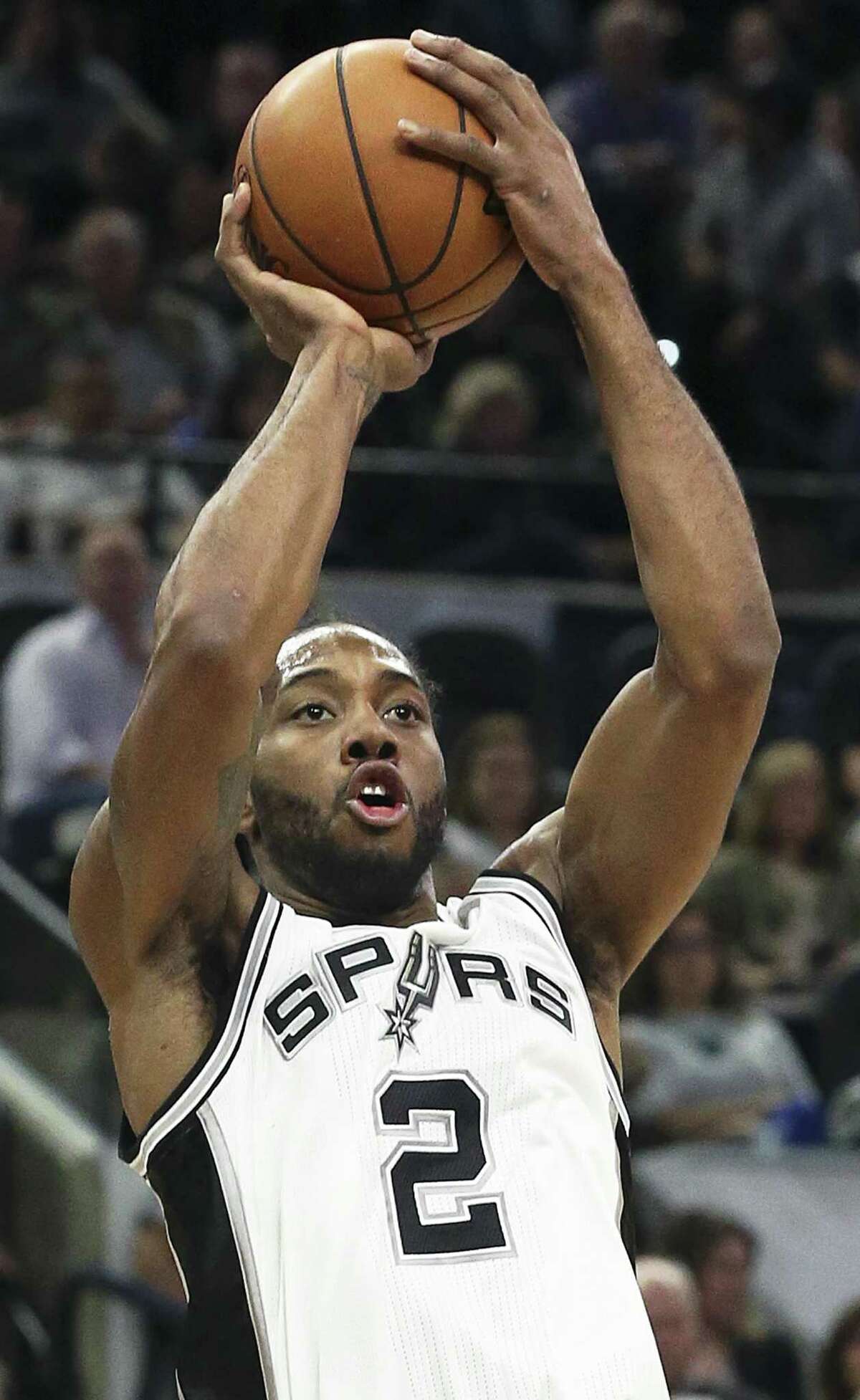 Kawhi Leonard takes a shot during a productive first half as the Spurs play the Raptors at the AT&T Center on Jan. 3.