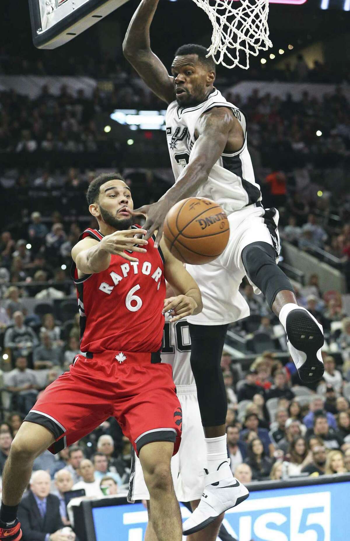 Dwayne Dedman forces Cory Joseph to pass to the outside as the Spurs play the Raptors at the AT&T Center on January 3, 2016.