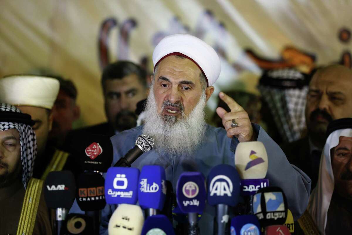 The Mufti of the Sunni Community in Iraq Sheikh Mehdi al-Sumaidaie speaks to media outlets in Baghdad, Iraq, Tuesday, January 3, 2017. Violence claimed the lives of at least 6,878 civilian Iraqis last year, the United Nations said on Monday, as the Iraqi government struggles to maintain security nationwide and to dislodge Islamic State group militants from areas under their control. (AP Photo/ Karim Kadim)
