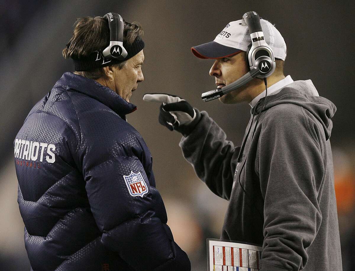 New England Patriots head coach Bill Belichick, left, talks with Patriots offensive coordinator Josh McDaniels after the Patriots scored their first touchdown during first quarter action of their NFL football game against the Pittsburgh Steelers in Foxborough, Mass. on Sunday, Dec. 9, 2007. (AP Photo/Stephan Savoia)