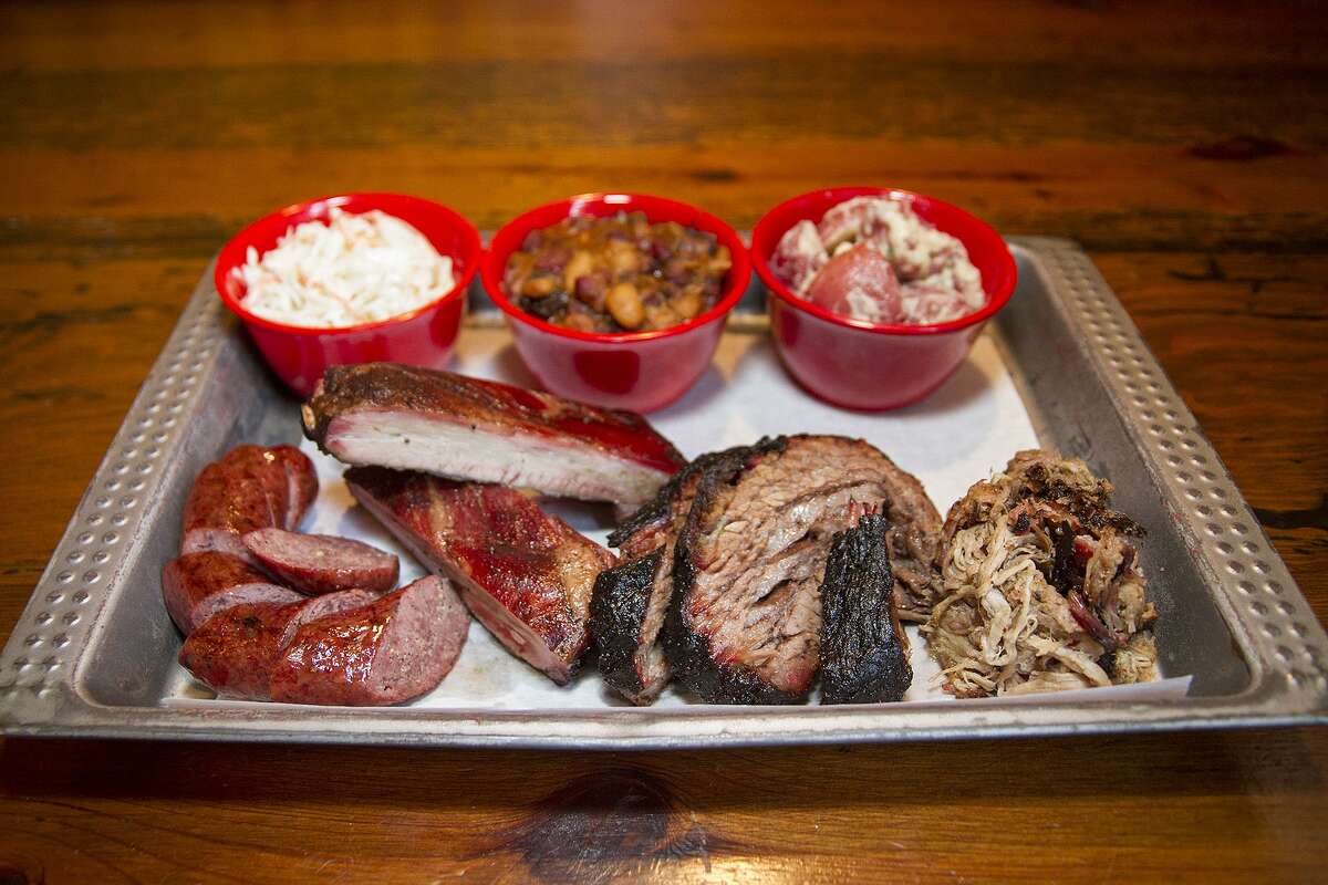 A barbecue lunch at The Granary ‘Cue and Brew might include sausage, pork ribs, brisket, pulled pork, cole slaw, beans and potato salad.