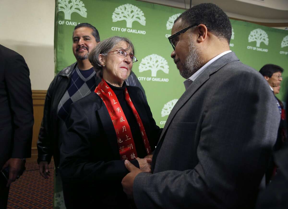 Anne Kirkpatrick meets with Anthony Finnell, Sr., Executive Director of the Citizens' Police Review Board, after she was introduced as the new Oakland police chief at a news conference in Oakland, Calif. on Wednesday, Jan. 4, 2017.