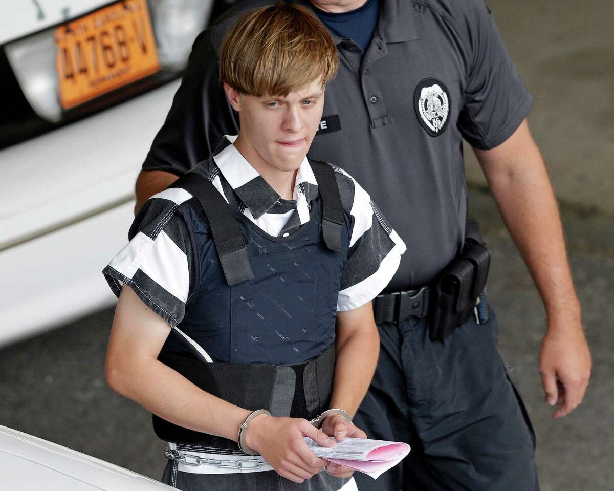 FILE - In this June 18, 2015 file photo, Charleston, S.C., shooting suspect Dylann Storm Roof is escorted from the Cleveland County Courthouse in Shelby, N.C. The sentencing phase of Roof's federal trial begins Wednesday, Jan. 4, 2016, in Charleston. He could face the death penalty or life in prison. (AP Photo/Chuck Burton, File)