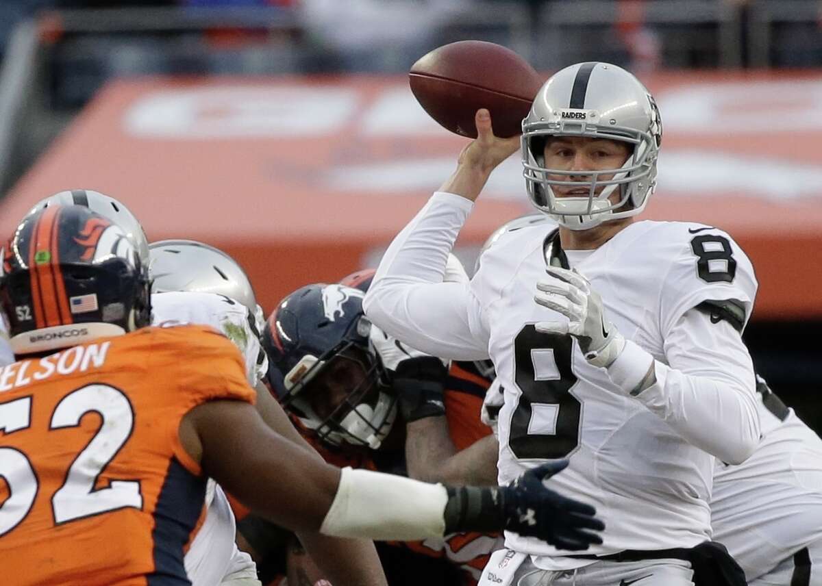 In this Sunday, Jan. 1, 2017, photo, Oakland Raiders quarterback Connor Cook passes against the Denver Broncos in the first half of an NFL football game in Denver. While the Oakland Raiders are giving no official word who will start at quarterback for their first playoff game in 14 years, the players are ready to go into the postseason behind rookie Cook. (AP Photo/Jack Dempsey)