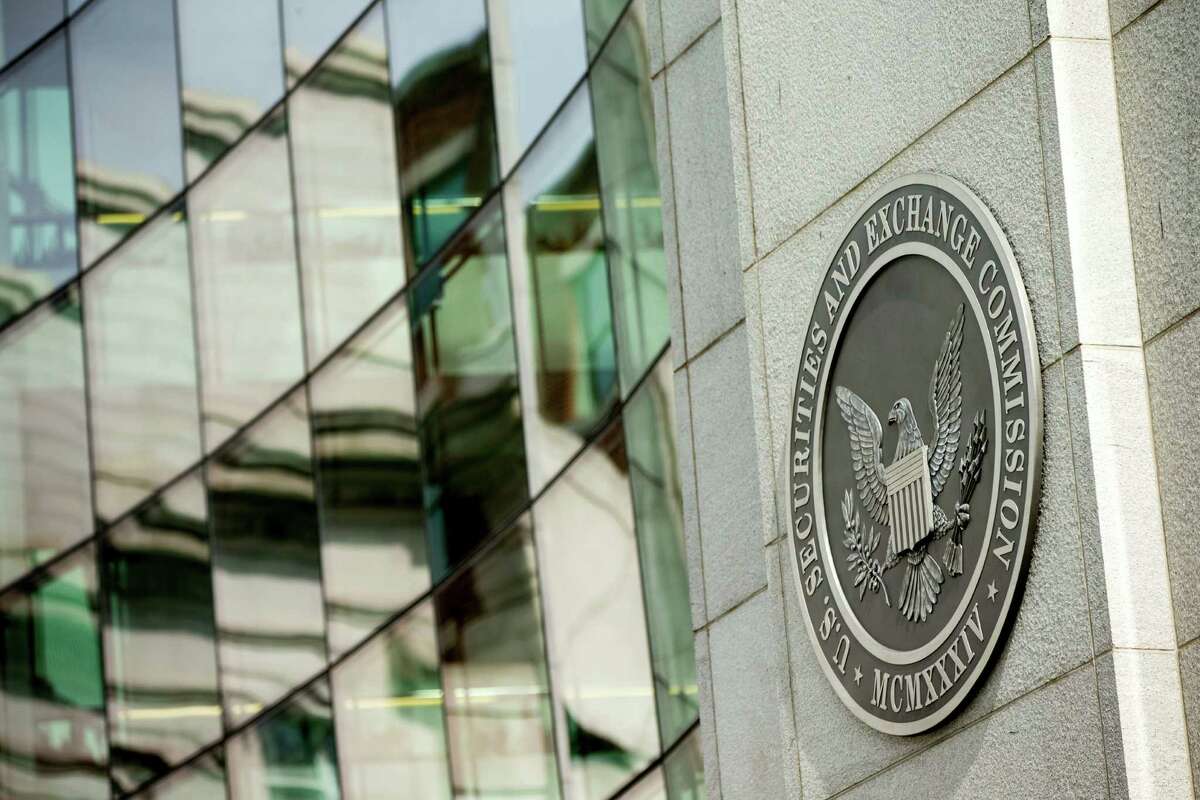 This Friday, June 19, 2015, photo shows the U.S. Securities and Exchange Commission building, in Washington. President-elect Donald Trump on Wednesday chose a Wall Street attorney with experience in corporate mergers and public stock launches as his nominee to head the Securities and Exchange Commission. Trump announced his nomination of Jay Clayton, a partner in the law firm Sullivan and Cromwell, as chairman of the independent agency that oversees Wall Street and the financial markets. (AP Photo/Andrew Harnik, File)