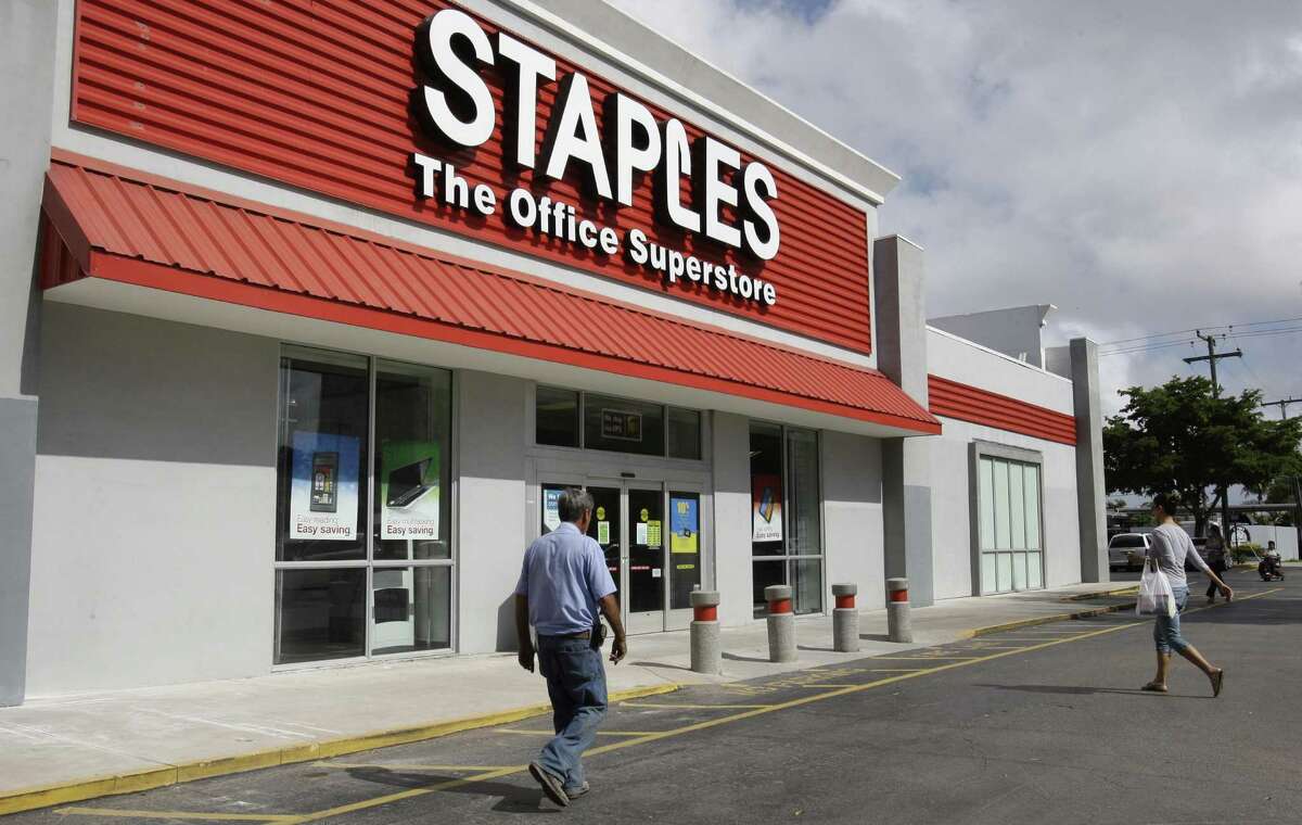 The United States Postal Service has agreed to curb a controversial arrangement allowing private employees to provide its services at Staples Inc. stores.