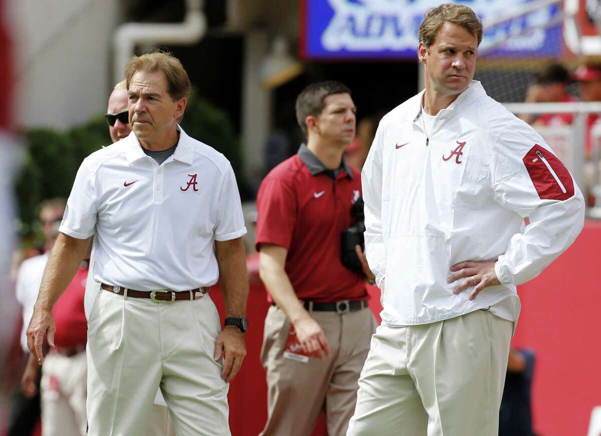 Alabama head coach Nick Saban, left, and offensive coordinator Lane Kiffin stand next to each other before an NCAA college football game against Louisiana Monroe in Tuscaloosa, Ala., Saturday, Sept. 26, 2015. (AP Photo/Jonathan Bachman)