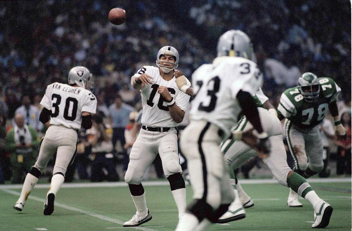 FILE - In this Jan. 25, 1981, Oakland Raiders quarterback Jim Plunkett (16) throws during NFL football's Super Bowl XV in New Orleans against the Philadelphia Eagles. He said in an interview with the San Jose Mercury News that his "life sucks" after playing in the NFL for 15 years.