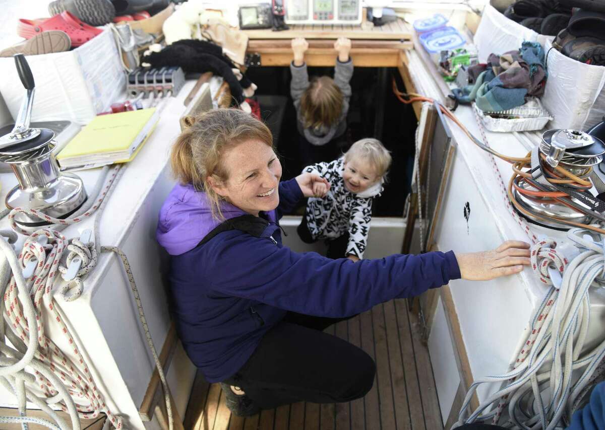 Sabine Schwörer and her daughter, Mia, 1, hang out on the deck of their 50-foot sailboat docked at Indian Harbor Yacht Club in Greenwich.