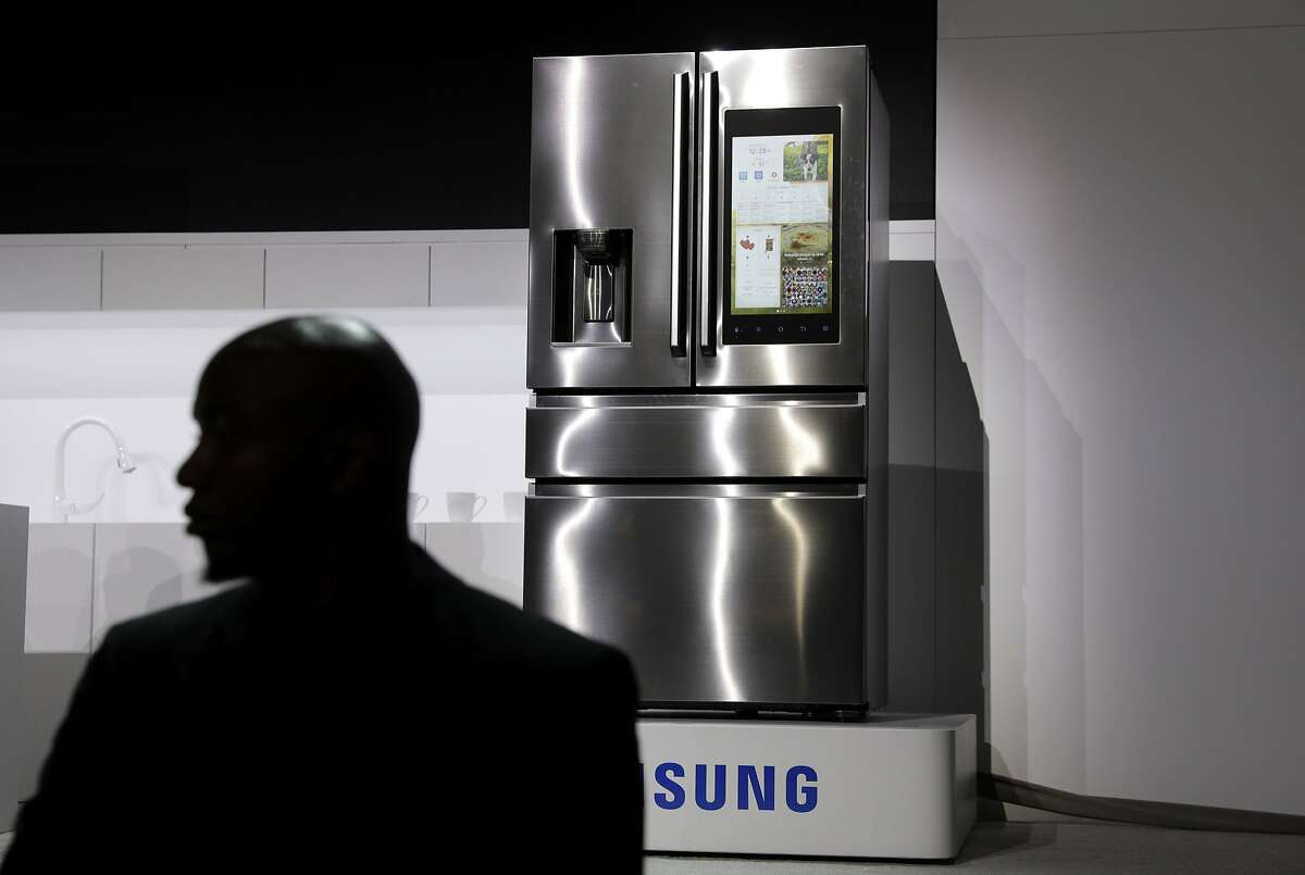 A refrigerator with Family Hub 2.0 is on display during a Samsung news conference before CES International, Wednesday, Jan. 4, 2017, in Las Vegas. Family Hub 2.0 features an interface on the refrigerator with apps that can be controlled by voice recognition. (AP Photo/John Locher)