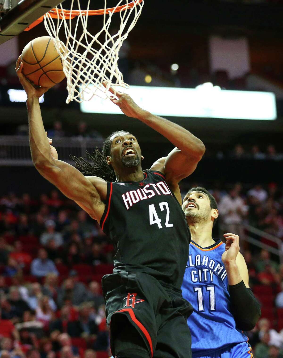 Nene attacks the basket for the Rockets during Thursday night's 118-116 win over the Thunder at Toyota Center. Nene hit all six of his shots en route to 18 points.