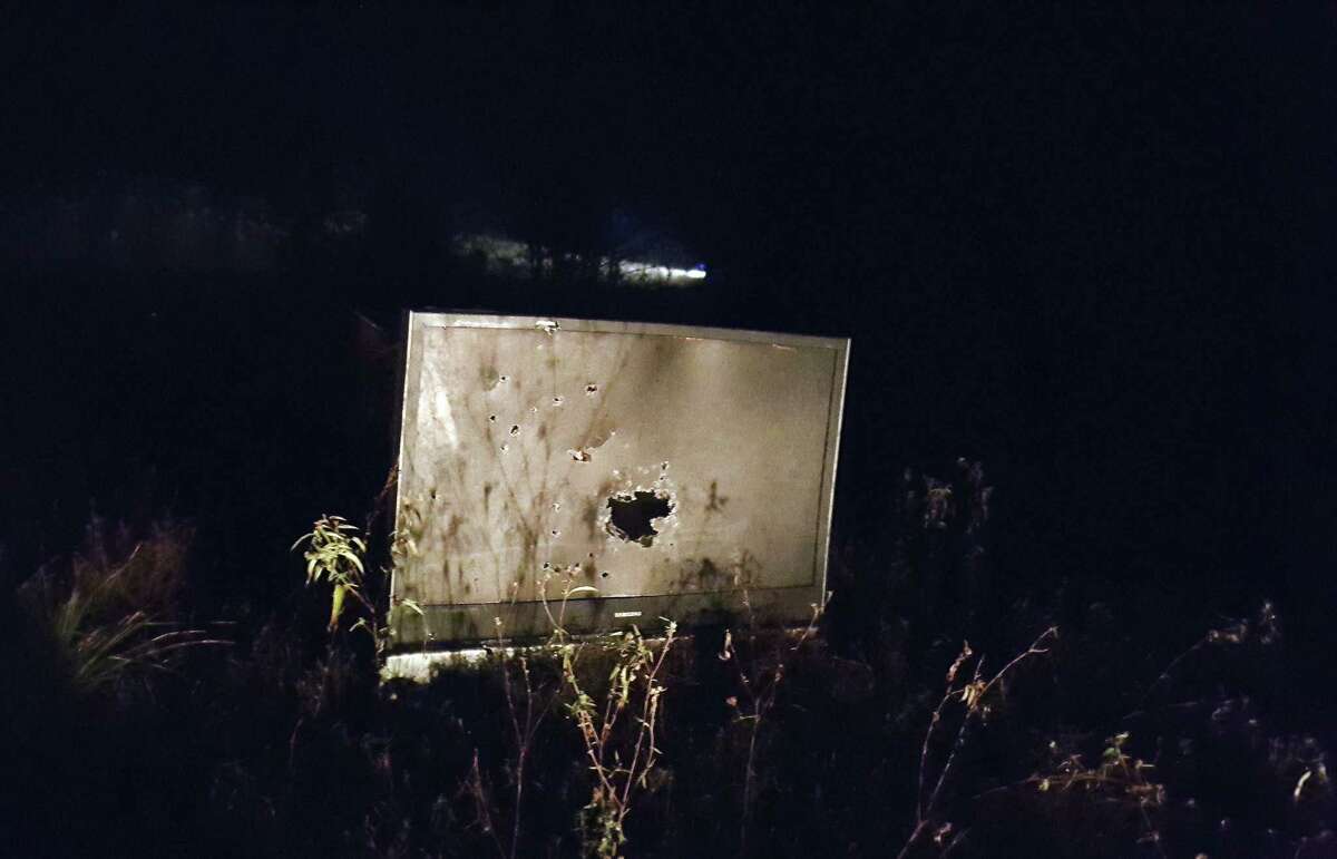 An abandoned television that has been used as target practice sits in a field in Kings Colony where Roman Forest Police officers and Montgomery County Precinct 4 Deputies patrolled and took measures to reduce the illegal use of firearms during New Year's Eve Dec. 31, 2016 and New Year's Day morning Jan .1.