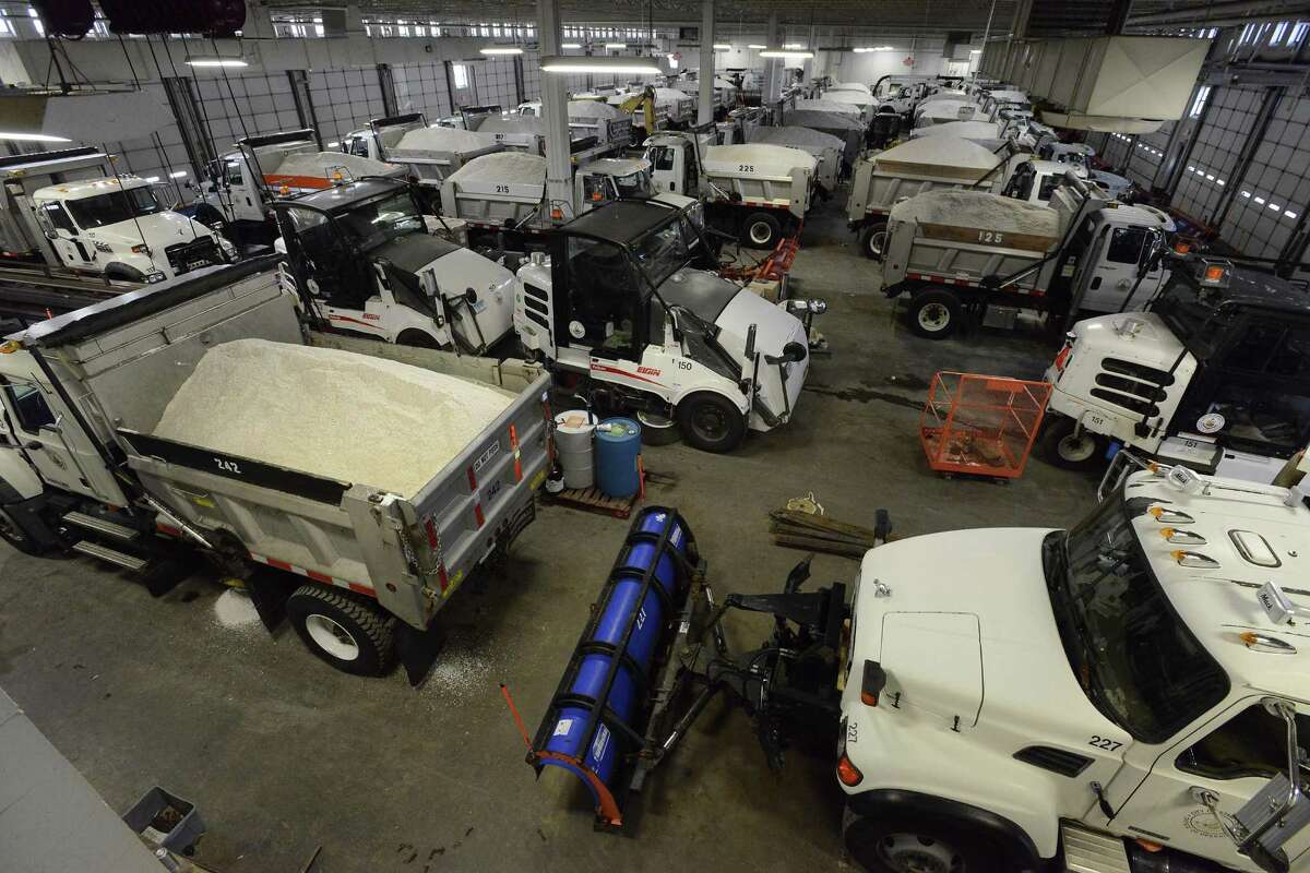 Snow plows stand ready to move out from the City of Stamford Highway and Maintenance facility on Magee Avenue. Crews spent the morning on Jan. 5, 2016 loading salters, preparing for a winter storm that was expected to hit the region overnight. The City Highways Division maintains over 315 miles of roadway, which is the largest municipal road system in the state.