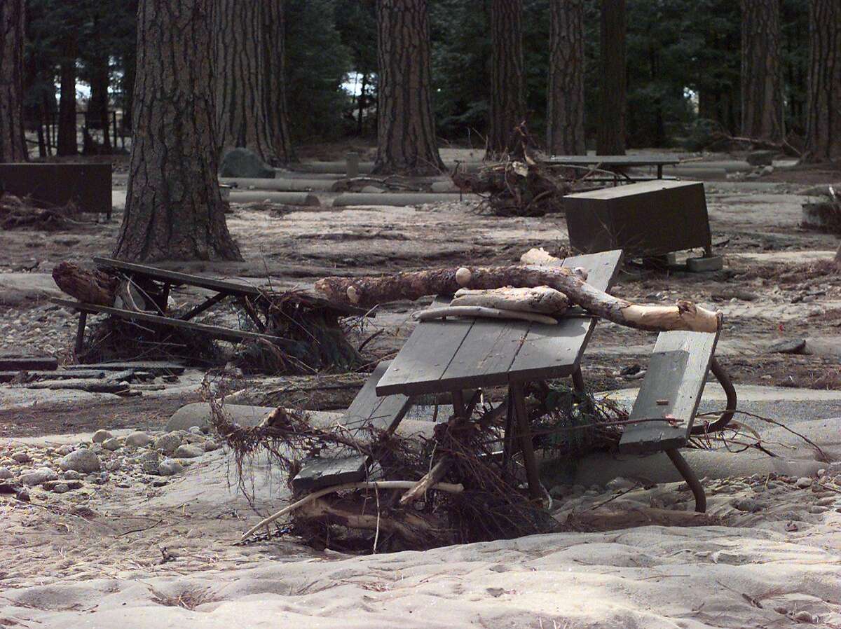 CAMPGROUND/C/08JAN97/MN/MACOR Lower Pines Campgroung with picnic tables and food boxes scattered and covered with debris following the Yosemite floods Chronicle Photo: Michael Macor