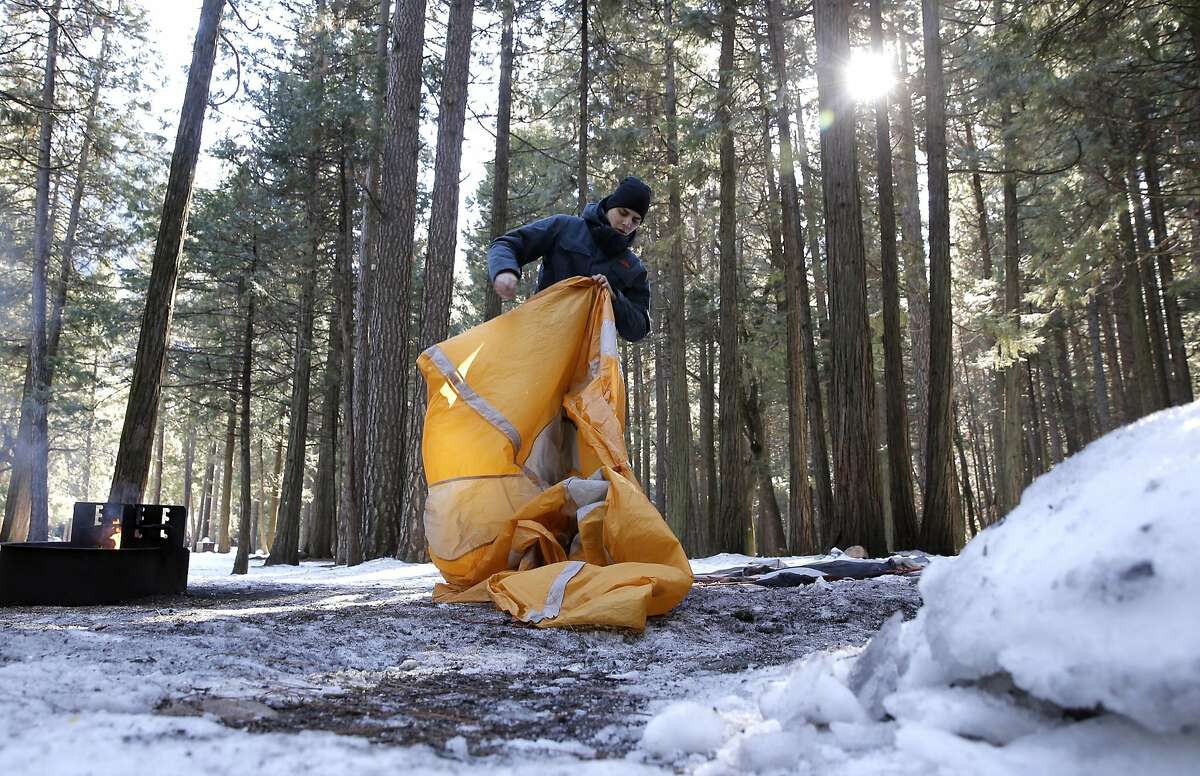 Will Anderson, (left) of San Marcos and Michael LaPlante of San Diego pack up their camping gear as they evacuate the Upper Pines campground in Yosemite National Park on Friday Jan. 6, 2017, where weather forecasters are expecting a huge storm to hit the valley over the next three days.