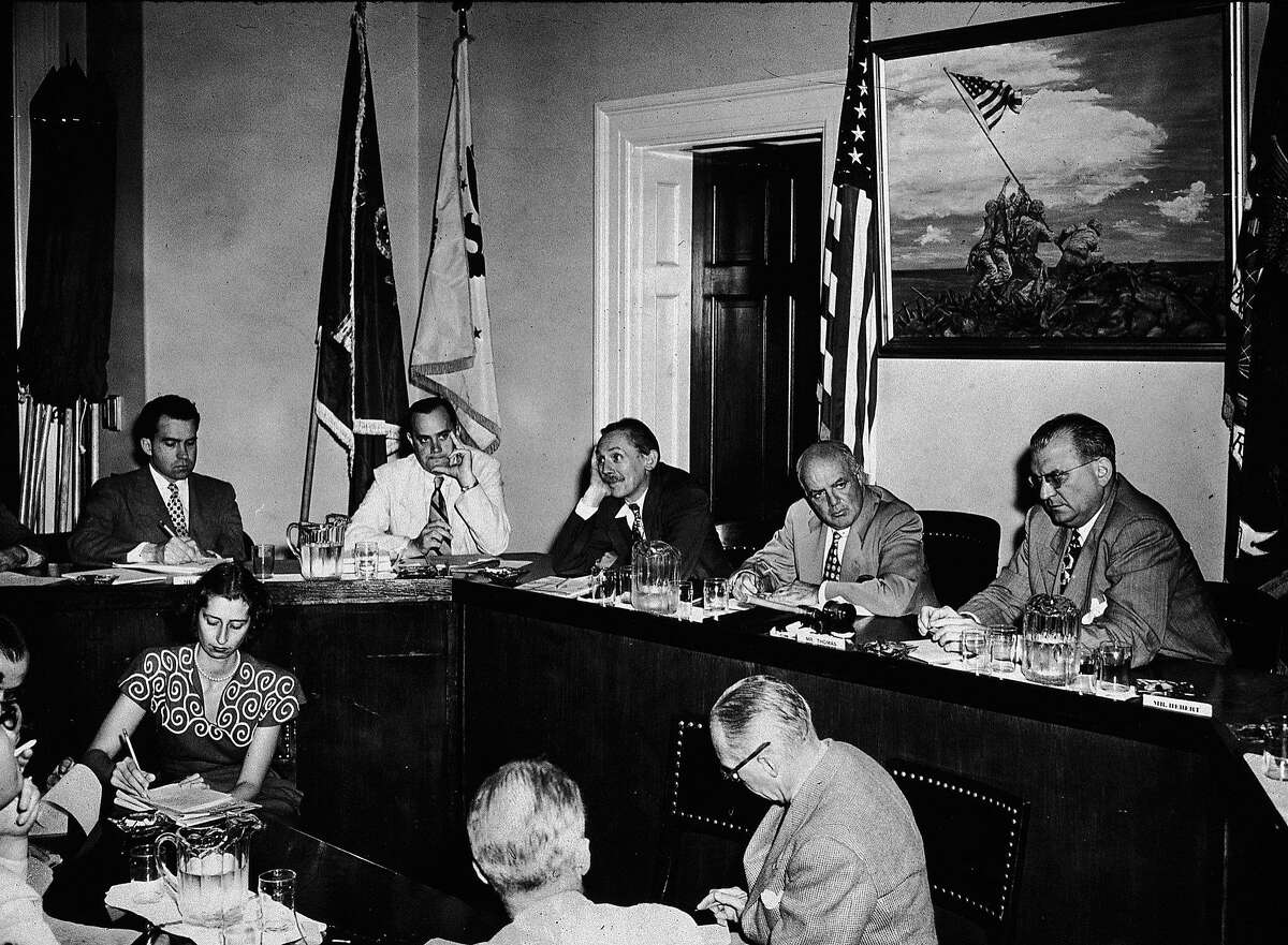 Members of the House Committee on Un-American Activities (HUAC) sit for an executive meeting, Washington DC, August 8, 1948. From left, future American President Richard Nixon (1913 - 1994), chief investigator Robert Stripling, and U.S. Representatives John McDowell (1902 - 1957), committee chairman J. Parnell Thomas (1895 - 1970), and F. Edward Hebert (1901 - 1979). (Photo by New York Times Co./Getty Images)