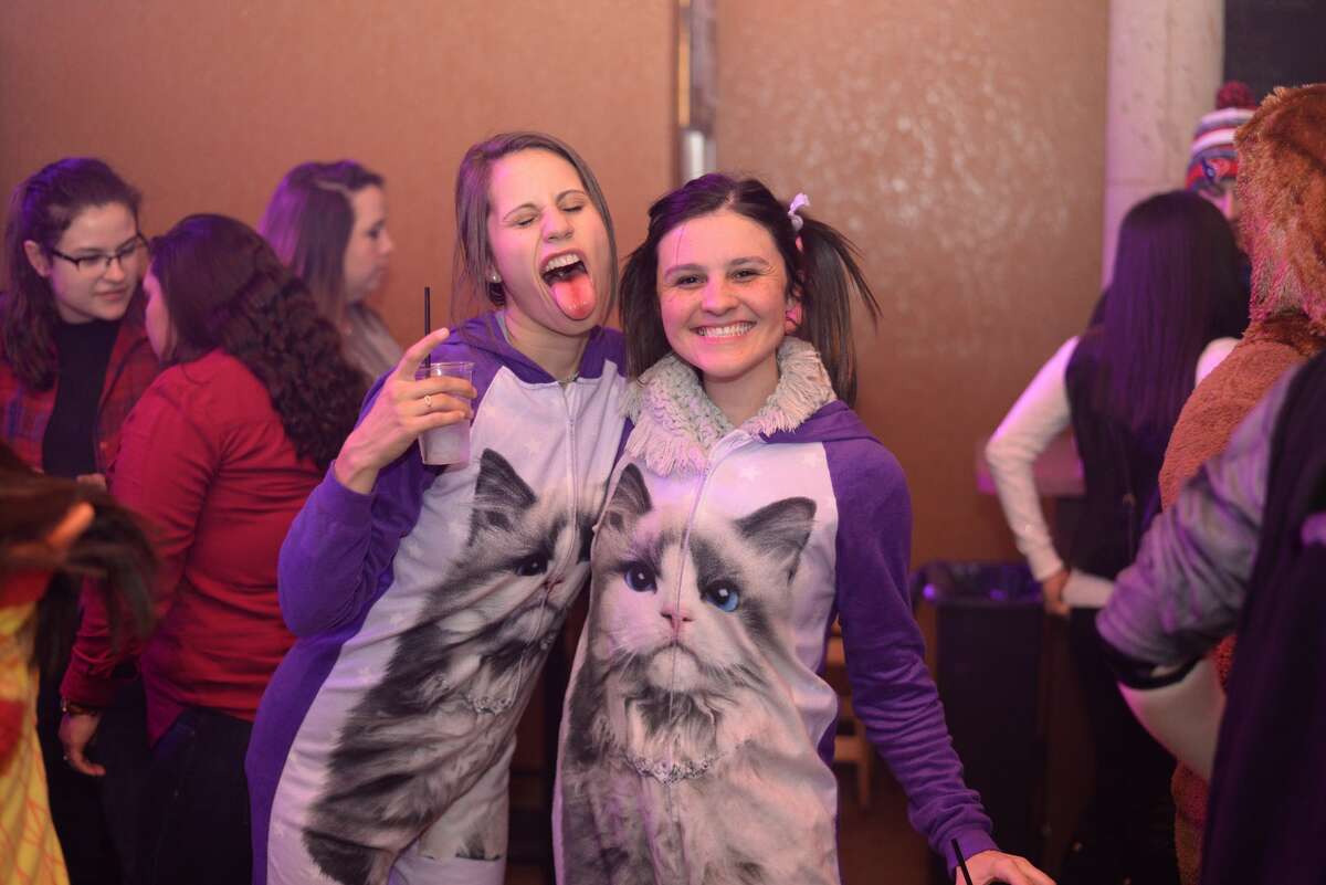 One of the best ways to beat the cold is a warm pair of pajamas, vigorous walking and multiple alcoholic drinks. Area residents put this to the test Friday night, Jan. 7, 2017, during the Onesie Pub Crawl.