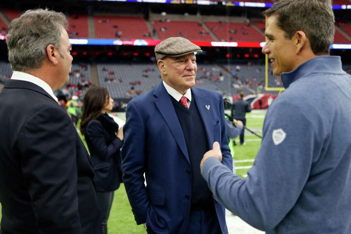 Trent Green, right, talks with Houston Texans owner Bob McNair, center, and his son Cal McNair, left, before an AFC Wild Card Playoff game at NRG Stadium on Saturday, Jan. 7, 2017, in Houston.
