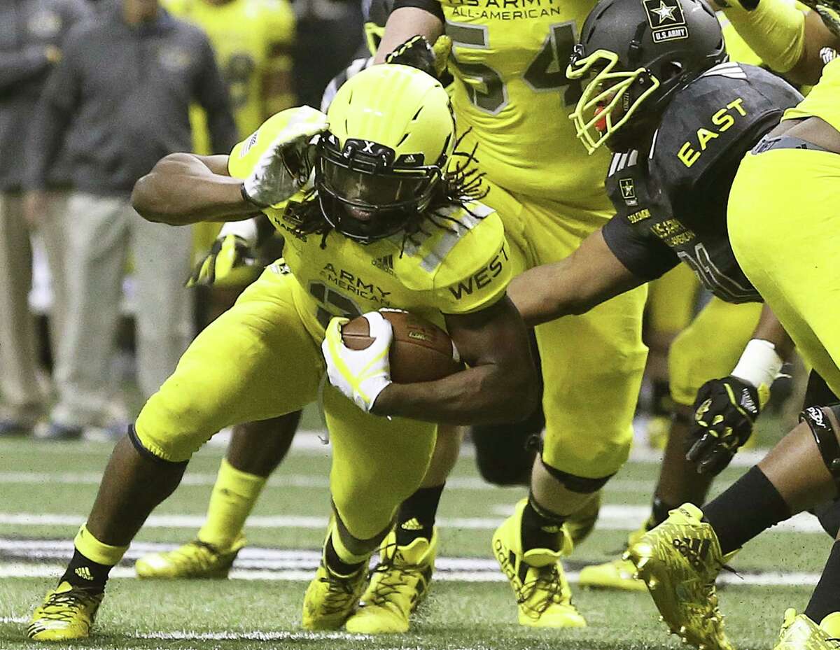 Najee Harris carries the ball in this year’s All-American Bowl. The U.S. Army will no longer sponsor the Alamodome game.
