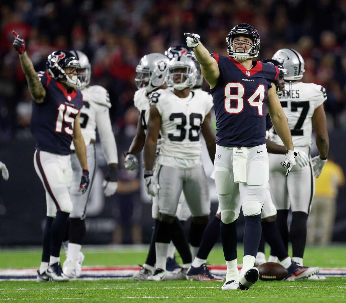 Houston Texans tight end Ryan Griffin (84) signals a first down after a run by running back Jonathan Grimes (41) during the fourth quarter of an NFL playoff game at NRG Stadium, January 7, 2017.
