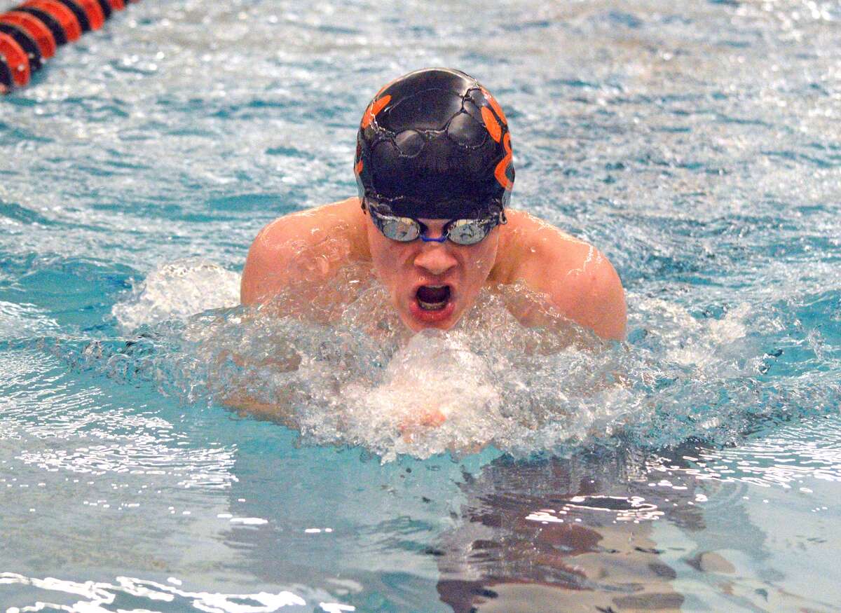 Edwardsville’s McLain Oertle competes in the 100-yard breaststroke on Saturday during the third annual Iron Invite at Normal Community High School.