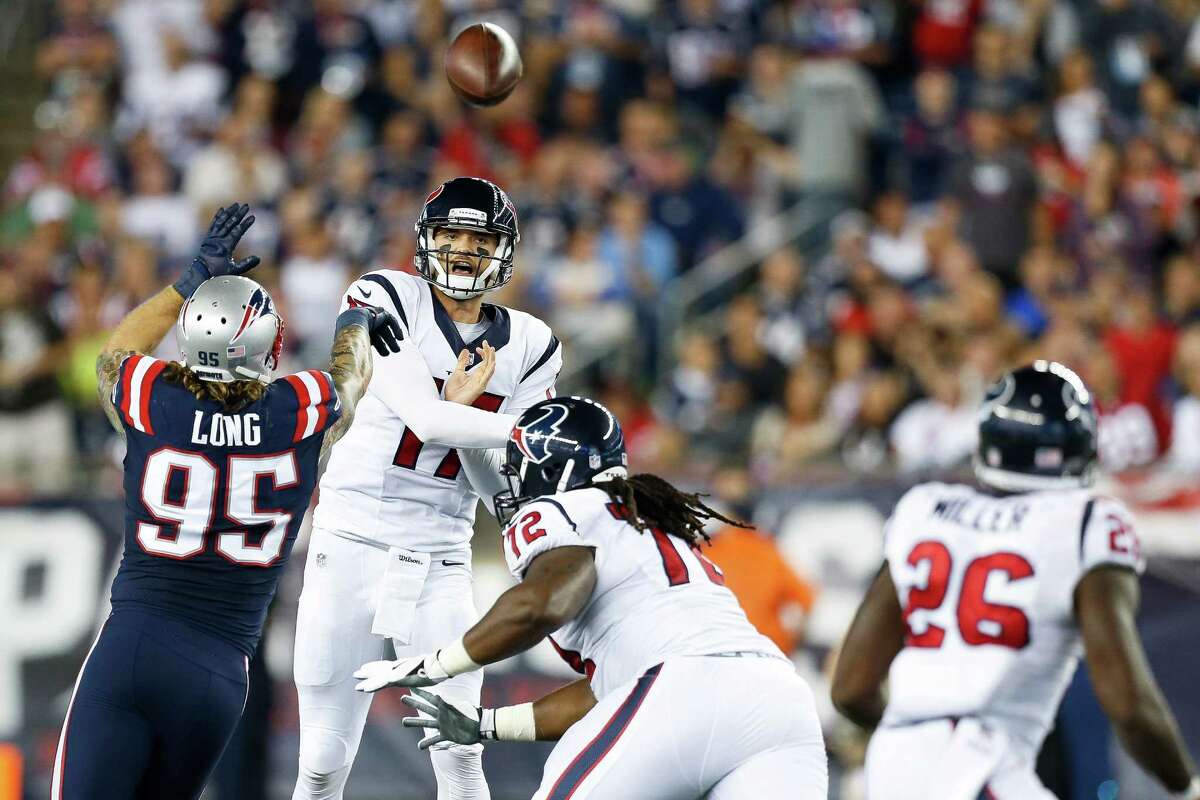 Quarterback Brock Osweiler (17) delivers a pass over Patriots defensive end Chris Long (95) during the second quarter of the Texans' loss early this season at Gillette Stadium, where the Texans are 0-4.