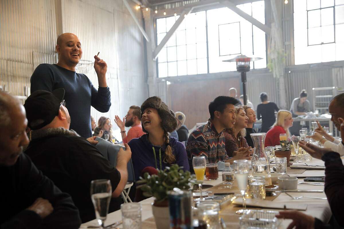 Cannaisseur founder, Ryan Bush, standing, chats with guests during a private Cannaisseur brunch in San Francisco, Calif., on Sunday, January 8, 2017. Coreen Carroll and Ryan Bush, founders of Cannaisseur, run their private monthly cannabis brunch/dinner for 20 guests in a secret spot, providing foodie satisfaction and cannabis products and cannabinoid-infused edibles.