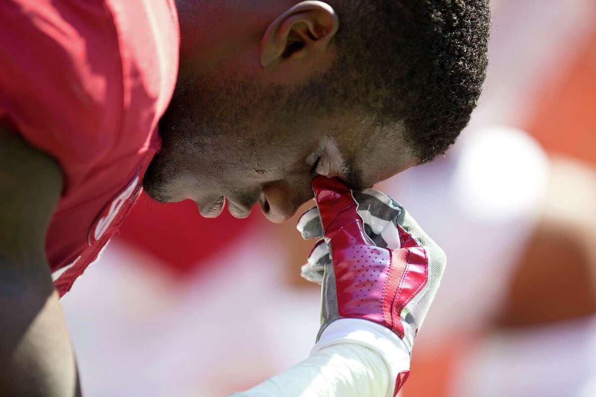 Alabama defensive back Deionte Thompson bows his head and kneels at the end zone before an NCAA college football game against Kent State, Saturday, Sept. 24, 2016, in Tuscaloosa, Ala. (AP Photo/Brynn Anderson)