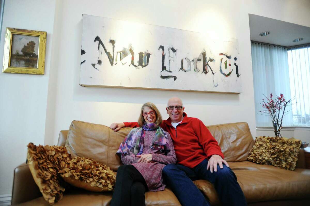 Judy Garfinkel and Jim Russek pose inside their Waterside home in Stamford, Conn. on Tuesday, Jan. 3, 2017.