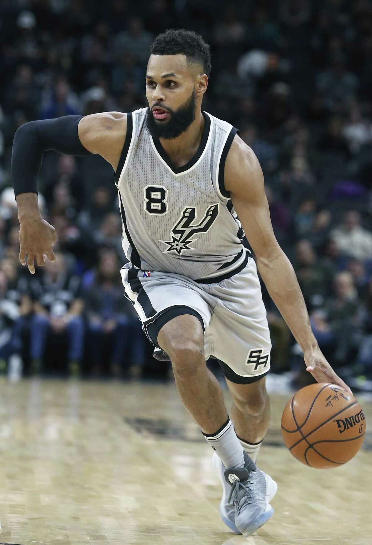 Patty Mills drives downcourt as the Spurs host the Trail Blazers at the AT&T Center on December 30, 2016.