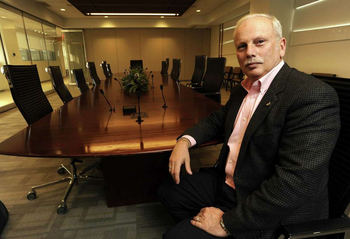 First County Bank Chairman and CEO Reyno Giallongo Jr., who also serves as First County Bank Foundation’s president, looks on in the boardroom of First County’s offices at 3001 Summer St.