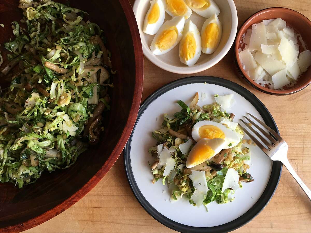 Raw, shaved Brussels sprouts serve as the base for this hearty salad with roasted mushrooms, wheat berries and hard boiled eggs.