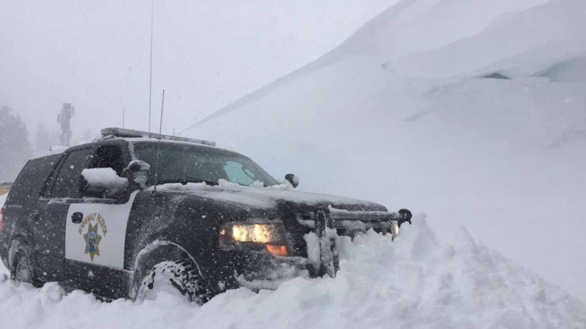 The CHP Truckee office shared this photo of a patrol vehicle parked next to a snow hill along I-80.