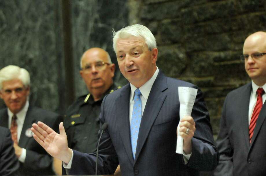 Sen. Phil Boyle, center, sponsored a bill that would ban minors from using indoor tanning facilities. (Cindy Schultz / Times Union) Photo: Cindy Schultz / 00032083A