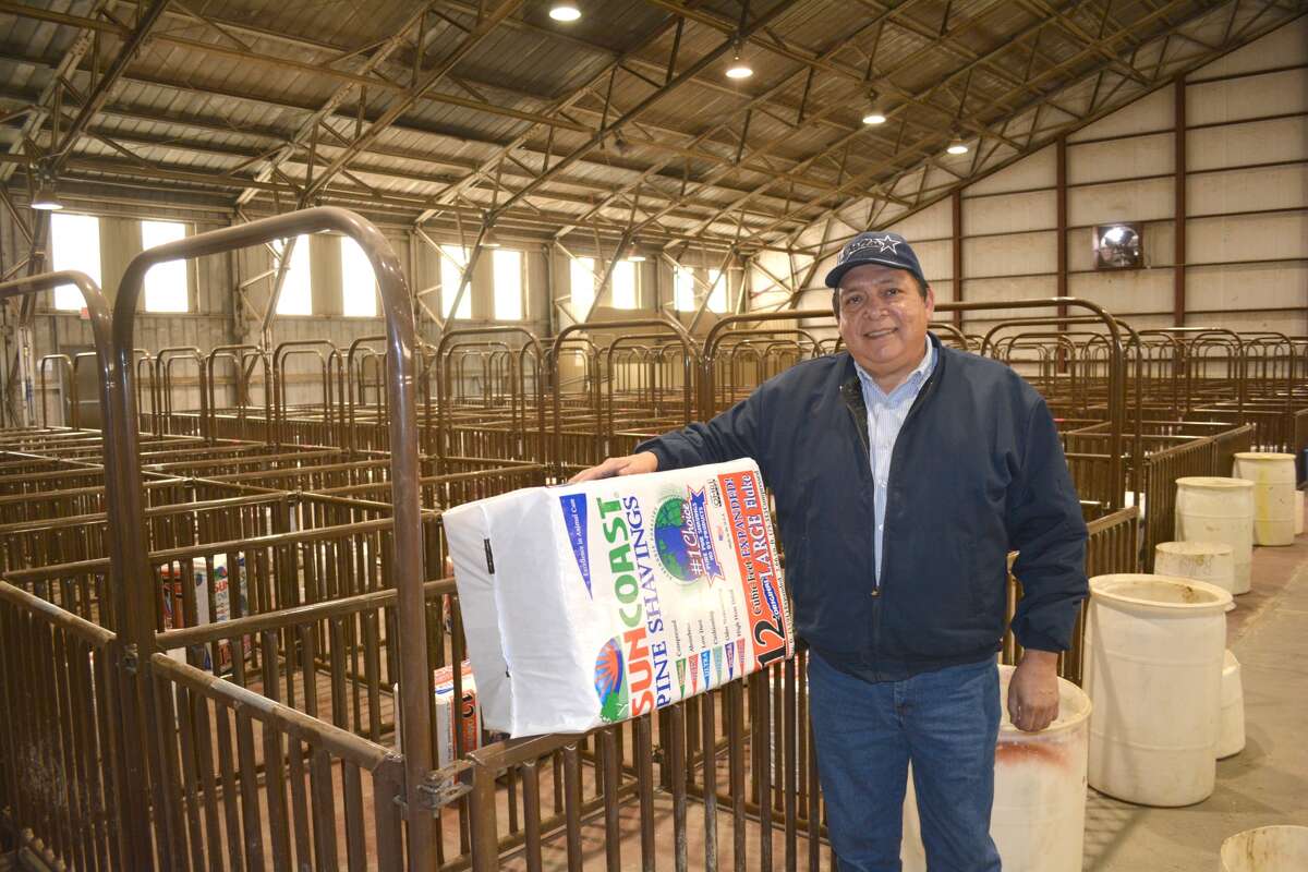 Doug McDonough/Plainview Herald Ollie Liner Center Manager Benito Garcia Jr. holds bailed wood shavings, which is used as bedding in the pens used to hold show animals this week’s stock shows. All the livestock pens are in place and the show rings prepared for the Plainview Local Stock Show, Jan. 11-12, followed by the 82nd Annual Hale County Stock Show Jan. 12-16.