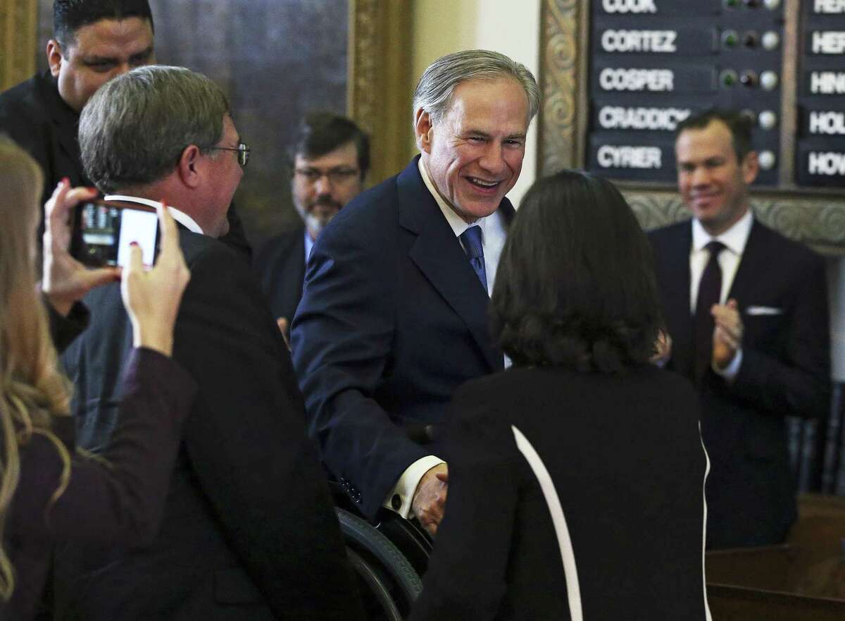 Governor Greg Abbott is greeted as he arrives in the House of Representatives as the 85th Texas Legislative session opens in Austin on January, 10, 2017.
