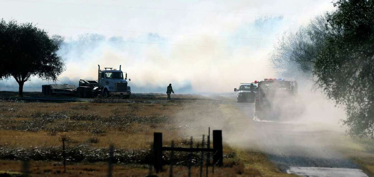 Multiple fire departments battle a grass fire Tuesday, Jan. 10, 2017 near St. Hedwig that has burned about 30 acres. County fire officials were notified shortly after noon Tuesday of the blaze, said Bexar County spokeswoman Monica Ramos. No one had been hurt in the fire as of 4: 00 p.m. but some structures were at risk.
