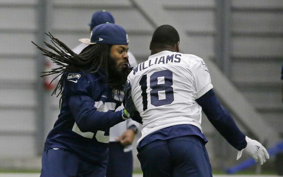 Seattle Seahawks cornerback Richard Sherman, left, runs coverage on wide receiver Kasen Williams after practice, Tuesday, Jan. 10, 2017, in Renton, Wash. The Seahawks will play the Atlanta Falcons in an NFL football NFC playoff game, Saturday, Jan. 14, 2017 in Atlanta (AP Photo/Ted S. Warren)