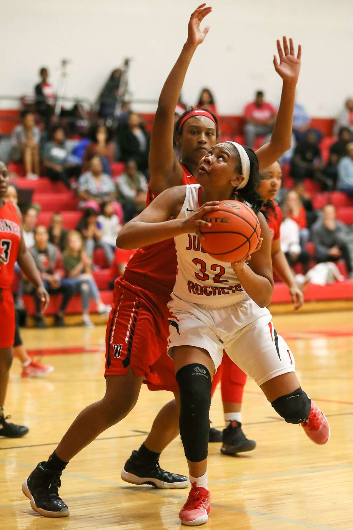 Judson’s Desiree Lewis (front) tries to drive past Wagner’s Da’Nasia Hool during the second half of a District 27-6A game at Judson on Jan. 10, 2017.