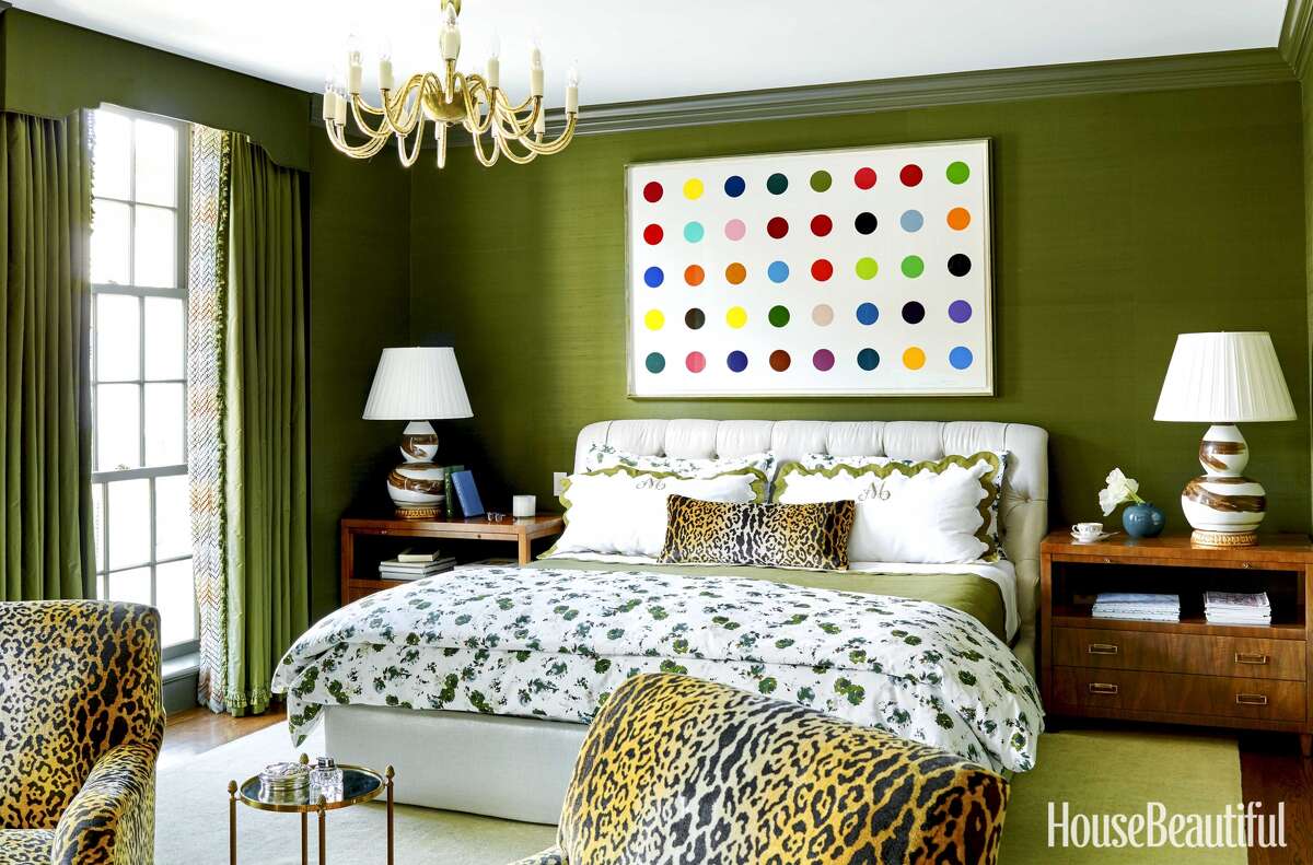 Dark green paint adds depth and personality to the master bedroom in the Houston home of Bailey McCarthy. Her home is featured in the new edition of House Beautiful magazine. Photos by Trevor Tondro