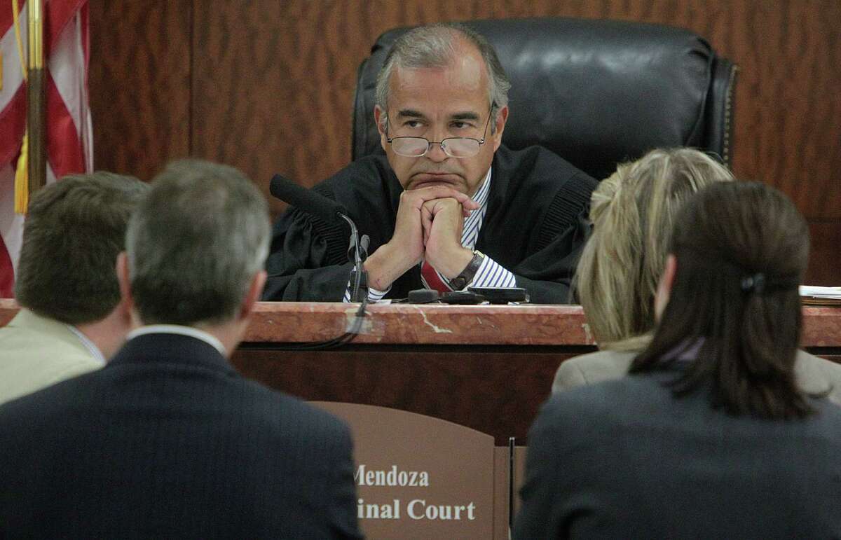 Judge David Mendoza listens to Defense Attorneys and Prosecution during a break of the Danaher Trial where Raul Rodriguez will be sentenced after the jury listens to witnesses at Harris County Criminal Courthouse on Monday, June 25, 2012, in Houston. Rodriguez, was convicted of murder in the shooting death of Kelly Danaher, who was having a loud party, and court resumes today. ( Mayra Beltran / Houston Chronicle )