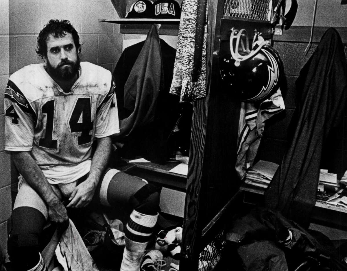 Dan Fouts of the San Diego Chargers sits in the locker room circa 1980s.
