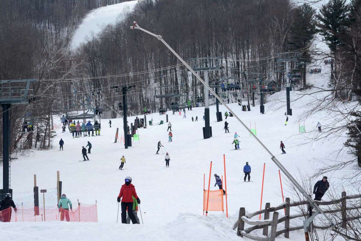 Skiers took to the slopes to enjoy the conditions at Jiminy Peak Mountain Resort in Hancock, Mass, Sunday, Jan. 1, 2017. While crowds were typically smaller, people weren't complaining. And compared to last year, which lacked any snow, ski resorts were reporting a brisk business even if they were not breaking any records. (Gillian Jones/The Berkshire Eagle via AP) (Gillian Jones/The Berkshire Eagle via AP) ORG XMIT: MAPIT103