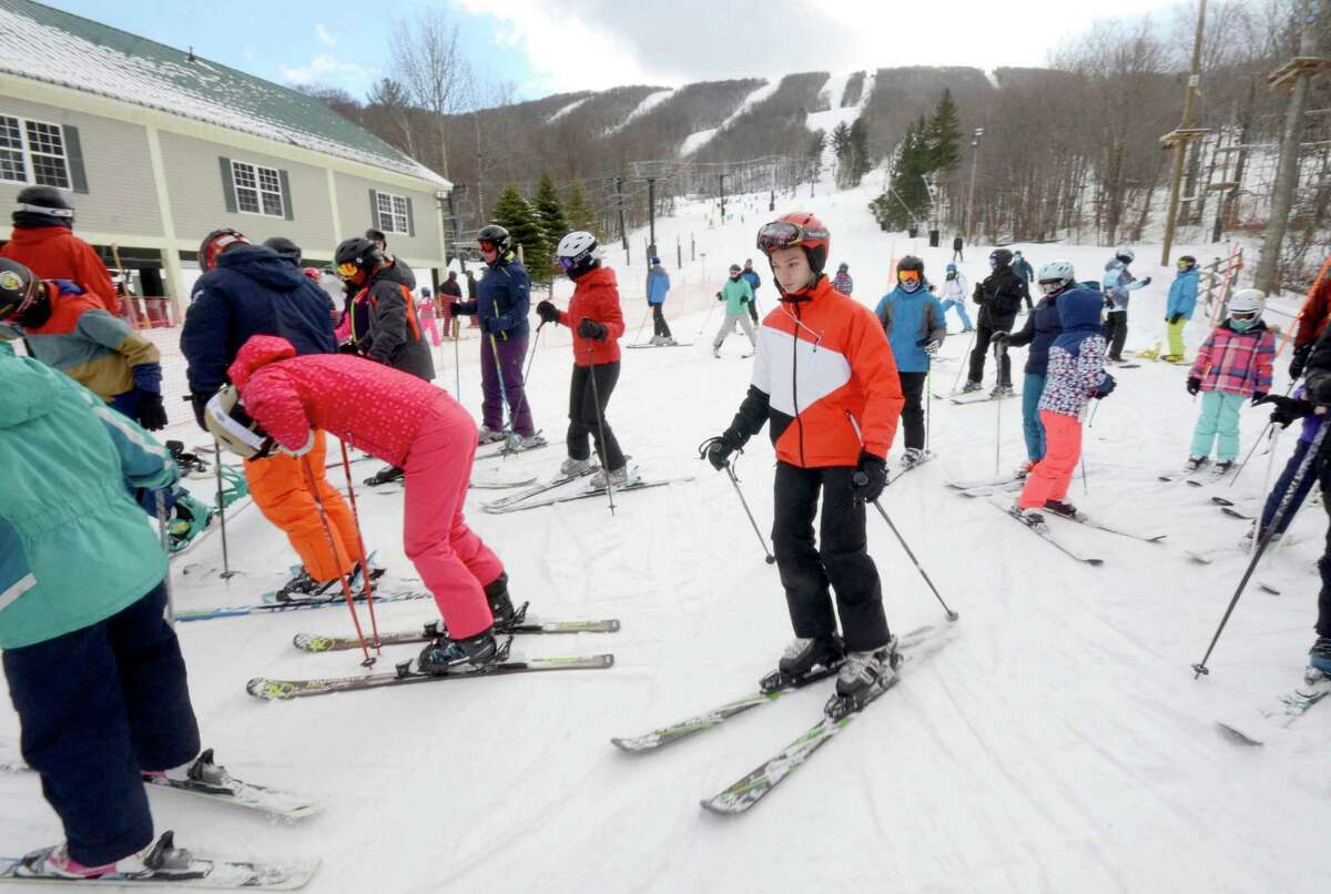 Skiers took to the slopes to enjoy the conditions at Jiminy Peak Mountain Resort in Hancock, Mass., Sunday, Jan. 1, 2017. While crowds were typically smaller, people weren't complaining. And compared to last year, which lacked any snow, ski resorts were reporting a brisk business even if they were not breaking any records. (Gillian Jones/The Berkshire Eagle via AP) ORG XMIT: MAPIT104