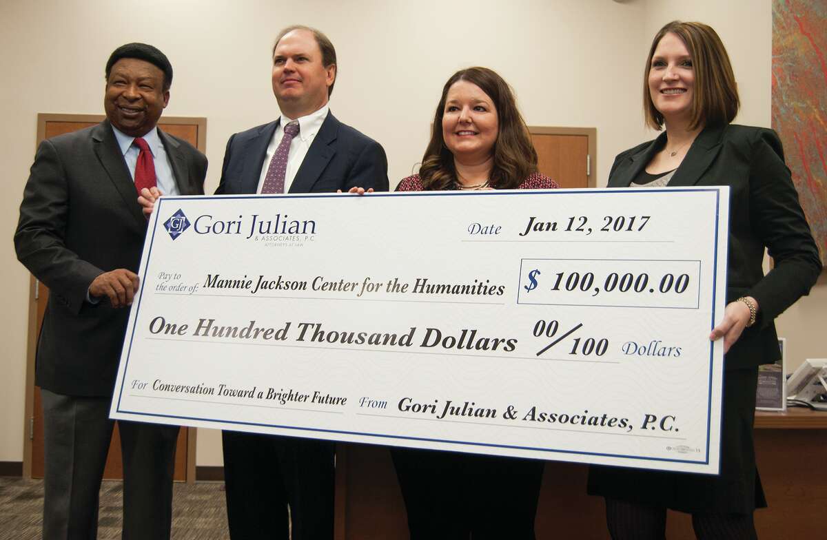 Mannie Jackson Center for the Humanities Foundation Executive Director Ed Hightower and Gori Julian representatives Randy Gori, Beth Gori, and Sara Salger pose with the $100,000 ceremonial check.