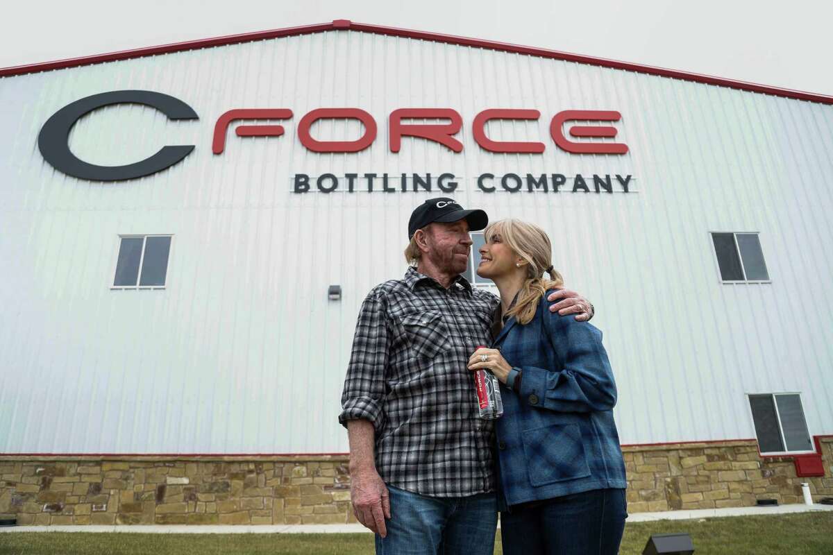 Chuck Norris and his wife, Gena Norris, outside the CForce plant.